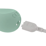Close-up of the charging plug and port of the Ritual Chi Rechargeable Silicone Clit Vibe Mint.
