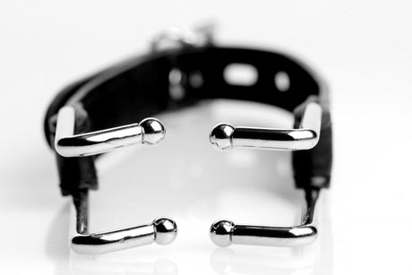 Strict Claw Hook Mouth Spreader Black close-up with metallic claw tips and adjustable strap.