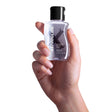 Astroglide Silicone Based Personal Lubricant 2.5 Oz held in a hand, featuring a sleek bottle design.