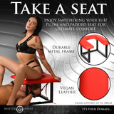 Master Series Face Rider Queening Chair showcasing a padded red seat and sturdy metal frame for enhanced comfort and stability.