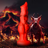 Fire Hound Silicone Dildo Medium stands tall with a vibrant red design in fiery, volcanic surroundings.