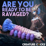Tenta-Queen Ovipositor Silicone Dildo with Eggs displayed with sci-fi themed background and dramatic text.