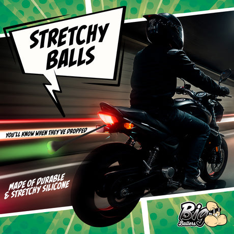 Teeny Weeny Light-Up Silicone Truck Nuts Black on a motorcycle with colorful graphics highlighting stretchy silicone.