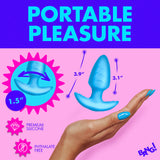 Bang Rotating & Vibrating Silicone Butt Plug Blue on a hand, showcasing premium silicone material and portable design.
