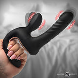 Master Series Thrust Pounder Thrusting Silicone Vibrator held in hand, showcasing its smooth silicone and vibrating features.