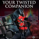 Scarlett Chainheart Bondage Pony Keychain Red attached to a stylish bondage-themed handbag, showcasing its unique design.