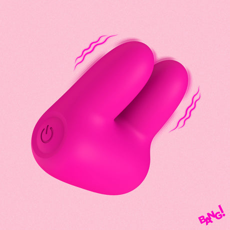 Bang Dual Silicone Clitoral Vibrator Pink shown with two soft silicone ears and rounded base on a pink background.