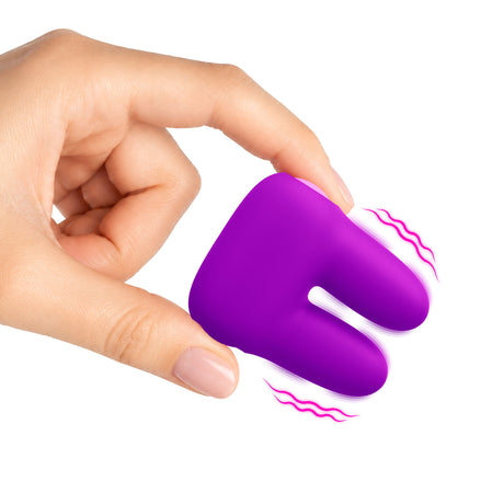 Dual Silicone Clitoral Vibrator Purple held in hand, showcasing soft silicone design and dual vibrating ears.