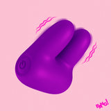 Dual Silicone Clitoral Vibrator Purple on a pink background, showcasing its ergonomic design and dual motors.