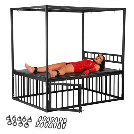 Master Series Bondage Bed with Cage featuring a model in a red outfit secured on the bed with various anchor points visible.