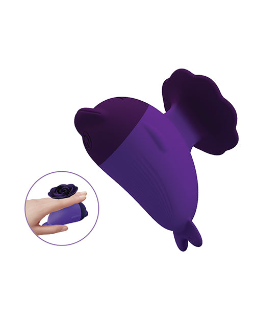 Pretty Love Dolphin Finger Vibe Purple shown in a hand, featuring a sleek and elegant design.