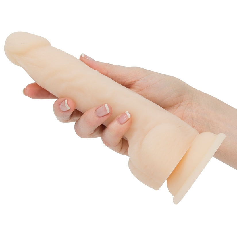 Naked Addiction Dual Density Dong Vanilla 8 Inch held in hand, showcasing realistic design and soft texture.