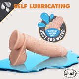 Dr Skin Glide 7 Inch Self Lubricating Dildo Vanilla on a blue surface with water droplets and a 'Slippery When Wet' label.