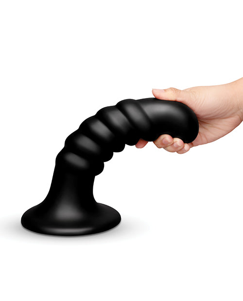 b-Vibe Krush 9.5 inch Curved & Ribbed Dildo Black held in hand showcasing its curvature and ribbed texture.