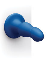 b-Vibe Gape 8.25 inch Bulbous Dildo with Suction Cup in blue color displayed on a wall.
