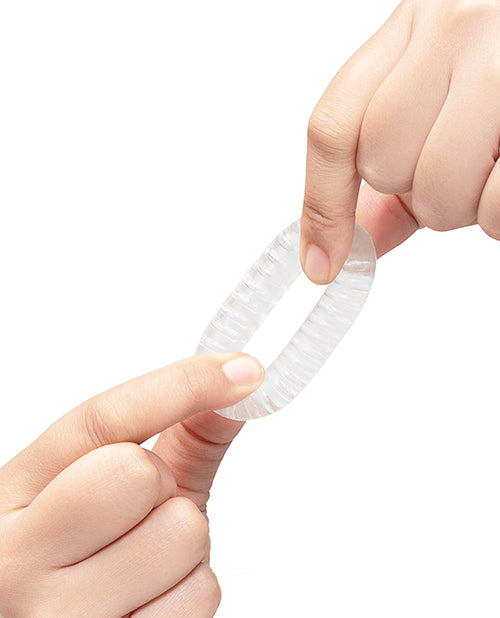 b-Vibe Stretch-Tech Swirl Flexible Secure Fit Cock Ring being held to show its texture and flexibility.