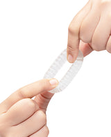 b-Vibe Stretch-Tech Swirl Flexible Secure Fit Cock Ring being held to show its texture and flexibility.