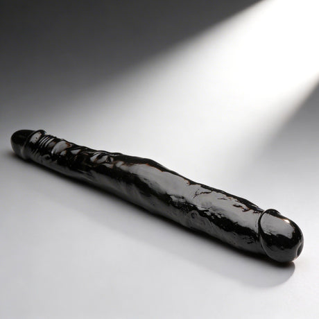 JOCK 13 Inch Tapered Double Dong Black on a smooth surface, showcasing its realistic detailing and dual heads.