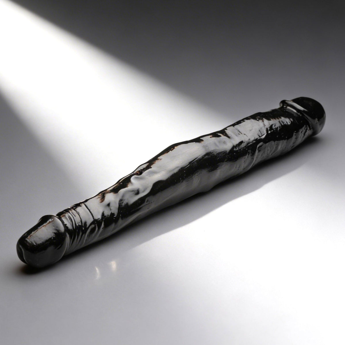 JOCK 13 Inch Tapered Double Dong Black featuring two tapered heads and realistic detailing for versatile pleasure.