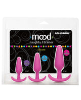 Mood Naughty 1 Anal Trainer Set Pink featuring three silicone butt plugs in graduated sizes: 3, 4, and 5 inches.