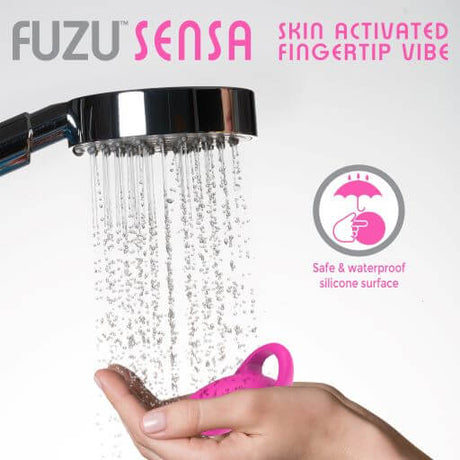 Fuzu Sensa Skin Activated Fingertip Vibe Pink with waterproof silicone surface under running water.