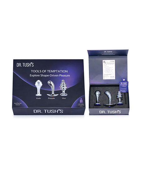 Dr Tush's Tools of Temptation Medium Anal Plug Set Metal display with three distinct metal plugs and packaging.