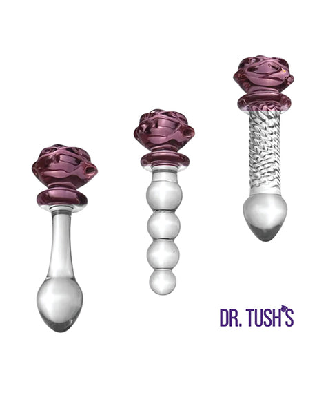 Dr Tush's Sacred Glass Rose Anal Plug Set featuring three elegant glass pieces with purple rose accents.