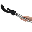 Doxy Rabbit G-spot Wand Attachment held in hand, featuring a silver wand with a black rabbit-shaped attachment.