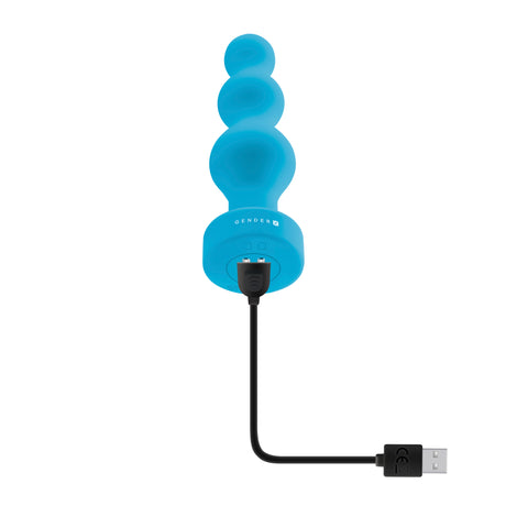 Gender X Plugged Up Vibrating Silicone Anal Plug Blue with charging cable, showcasing its ribbed design and silicone material.