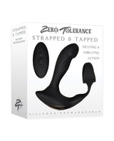 Zero Tolerance Strapped & Tapped Prostate Massager Black packaging with heating and vibrating features.