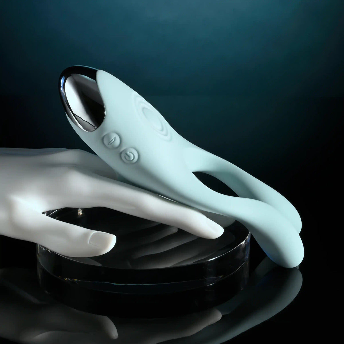 Evolved Couples Therapy Silicone Vibrator Green displayed on a hand with a sleek design and dual vibrating antennae.