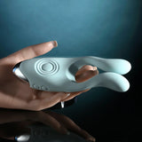 Evolved Couples Therapy Silicone Vibrator Green held in hand, featuring flexible antennae and a unique design for shared pleasure.