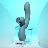 Evolved Take Your Flick Dual Motor Rabbit Vibrator displayed on clear stand against blue background.