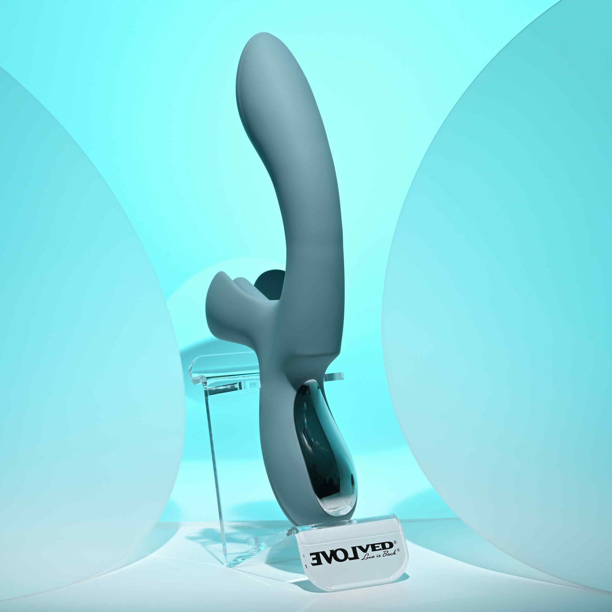 Evolved Take Your Flick Dual Motor Rabbit Vibrator displayed against a soft blue background.