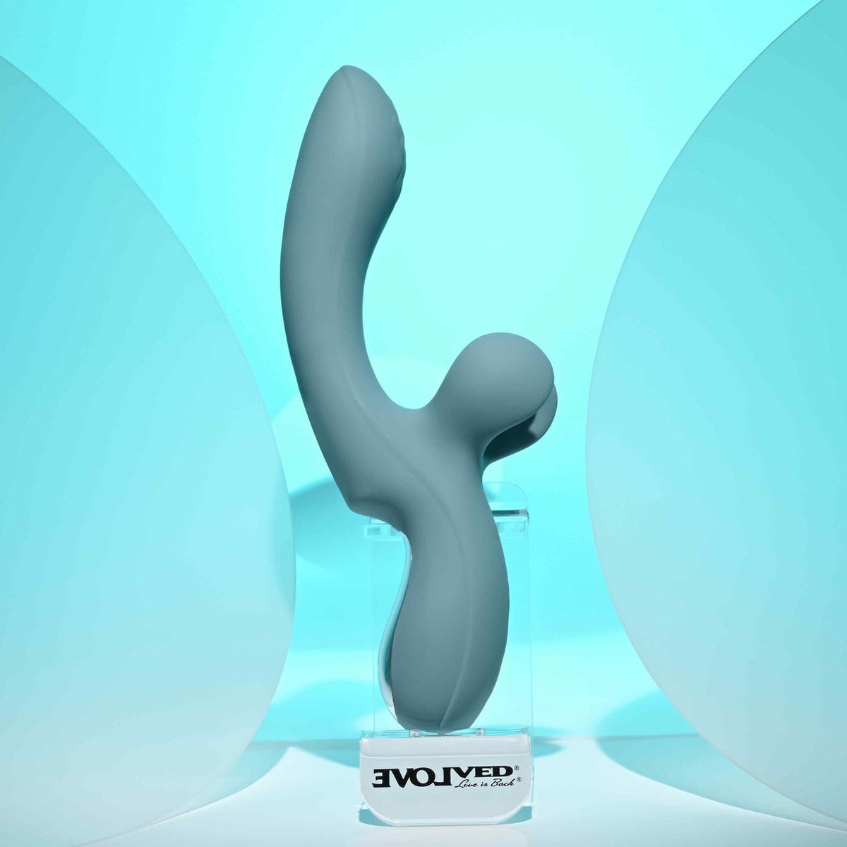Evolved Take Your Flick Dual Motor Rabbit Vibrator displayed against a soft blue background, showcasing its unique design.