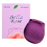 Bella Rose Shaped Suction Vibrator Purple next to its elegant packaging, showcasing its rose shape design.