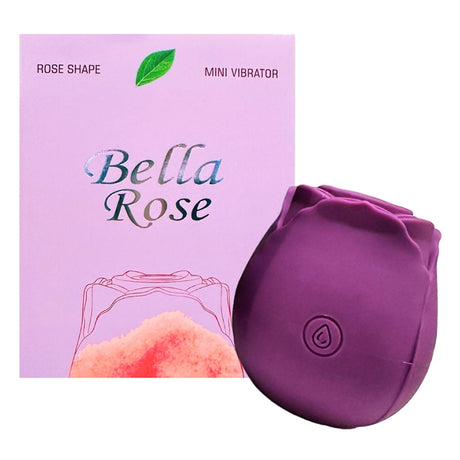 Bella Rose Shaped Suction Vibrator Purple next to its elegant packaging, showcasing its rose shape design.