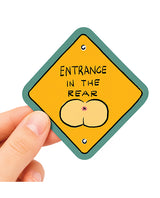 Entrance In The Rear Funny Vinyl Sticker being held, featuring a humorous design with playful imagery.