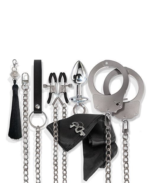 Nixie Interchangeable 8 Piece Bondage Kit Silver accessories including cuffs, chains, and teasing elements.