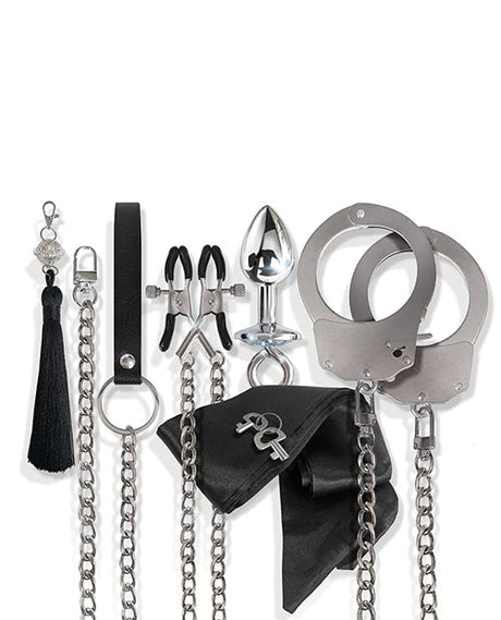 Nixie Interchangeable 8 Piece Bondage Kit Silver accessories including cuffs, chains, and teasing elements.