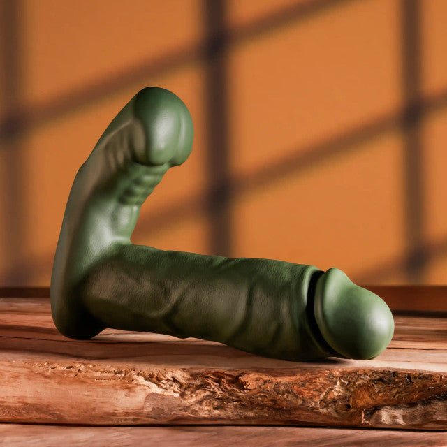 Gender X The Hunk Thrusting Vibrating Dildo Green in a realistic design, showcasing its dual-shaft and thrusting capabilities.