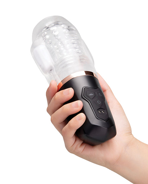 He-Vibe Vibrating Suck Master Male Masturbator held in hand showcasing its design and controls.