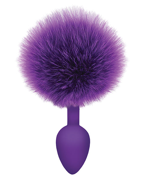 The 9's Cottontails Silicone Bunny Tail Butt Plug Purple with a fluffy purple tail and a smooth tapered body.