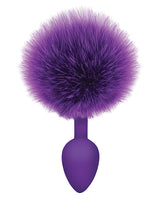 The 9's Cottontails Silicone Bunny Tail Butt Plug Purple with a fluffy purple tail and a smooth tapered body.