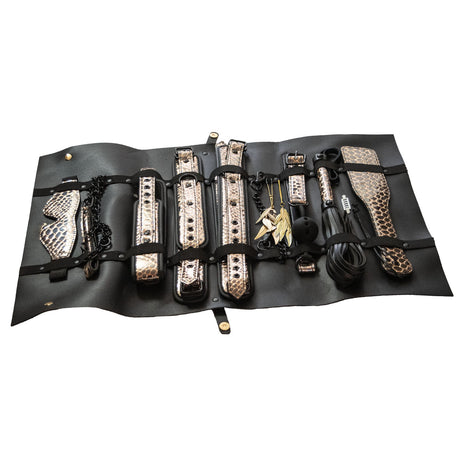 The Traveler 10 Piece Restraint and Bondage Play Kit displayed in a stylish travel case with black and rose gold designs.