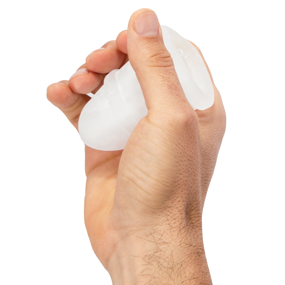 Screaming O Jackits Masturbation Sleeve Clear held in hand, showcasing its soft design and ergonomic grip.