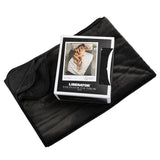 Liberator Fascinator Fur Throw Queen Black displayed with its packaging on a smooth surface.