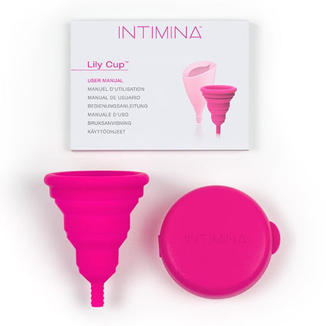 Intimina Lily Cup Compact Size B Menstrual Cup with protective case and user manual in a pink color.