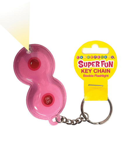 Close-up of the Super Fun Boobie Flashlight Keychain, featuring a pink keychain with a light and label.