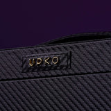 Close-up of UPKO logo on luxurious black leather bondage tools case with textured design.